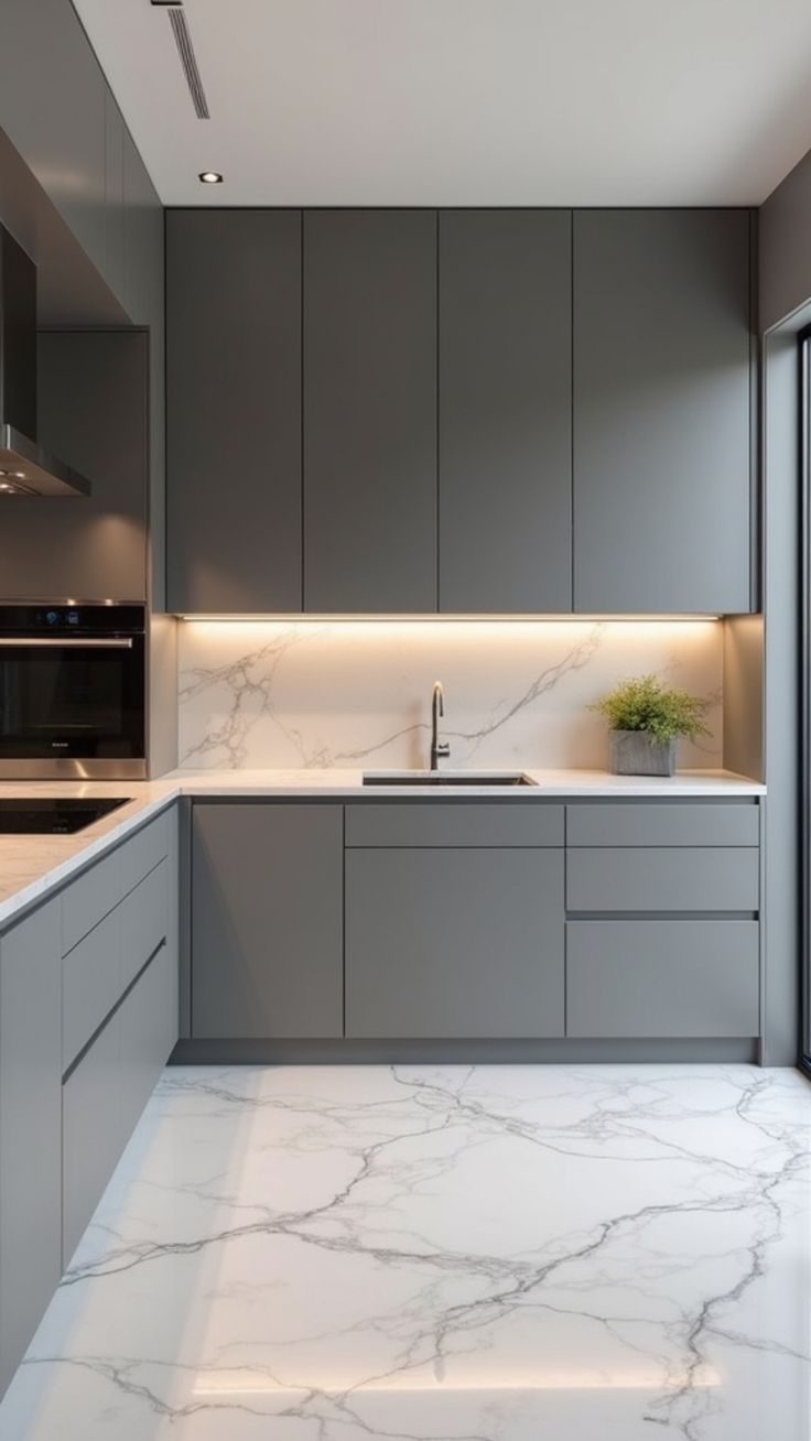 Elegant grey kitchen with quartz countertop and integrated lighting