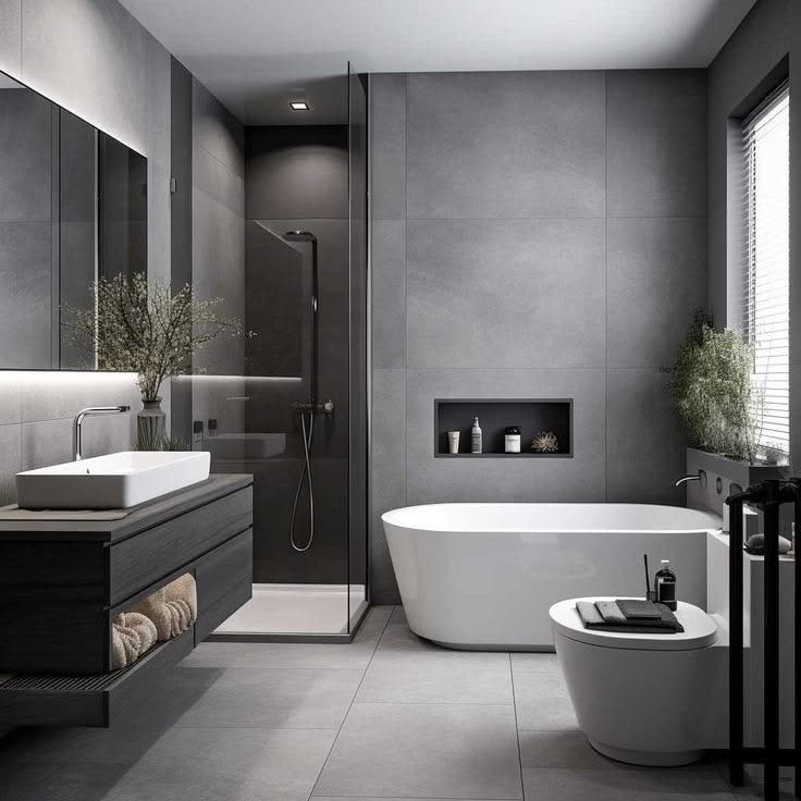 Modern grey bathroom with freestanding bathtub and black tapware